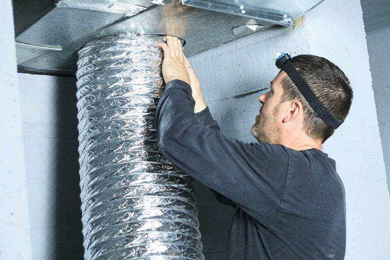 man cleaning ducts
